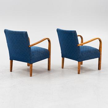 A a pair of stained birch armchairs 1930s-40s.