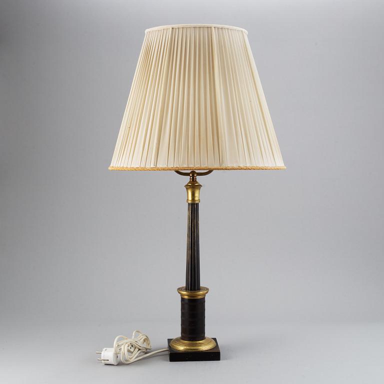 An empire style table lamp from the first half of the 20th century.