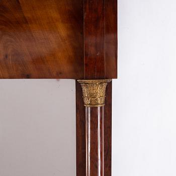 An Empire mirror and console table, first half of the 19th century.