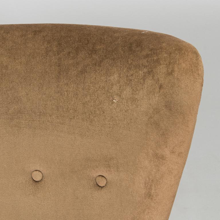 A pair of mid-20th century armchairs.