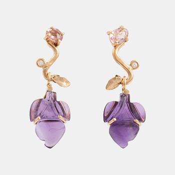 Earrings with cut amethysts, tourmaline, and small diamonds.