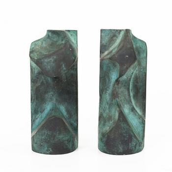 Björn Selder, a pair of green-patinated bronze sculptures/bookends, signed and numbered 4/100.