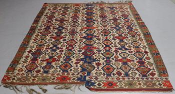 A carpet, a kilim, an antique Anatolian, ca 310-326 x 183,5-192 cm.