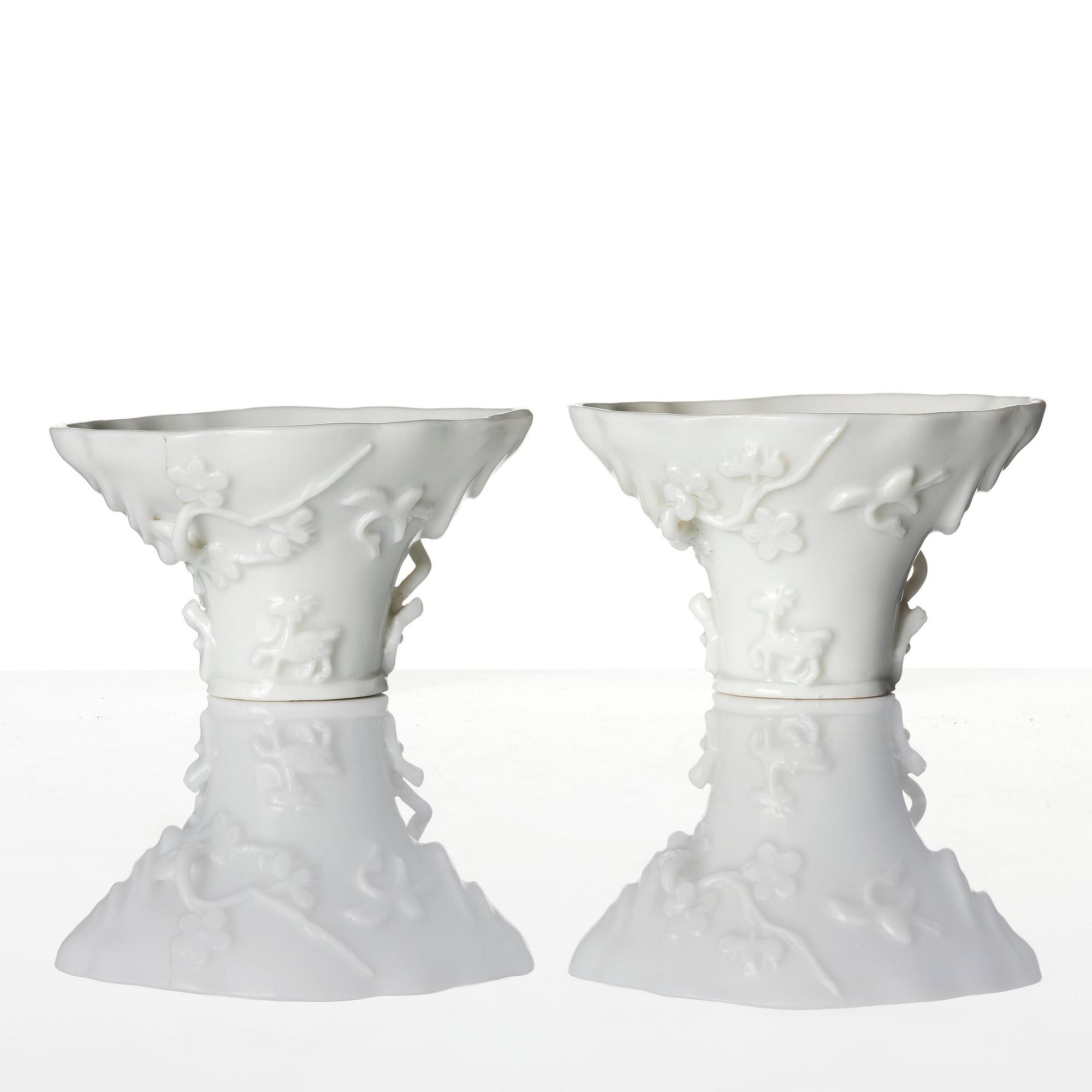 Two blanc de chine rhinoceros libation cups, Qing dynasty, Kangxi (1662-1722).