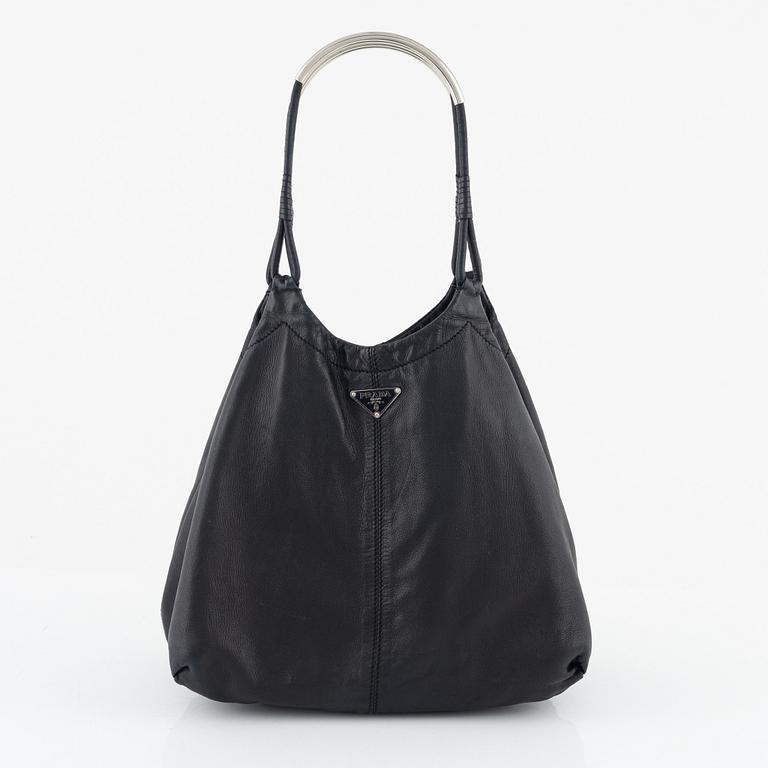 Prada, A black leather bag.