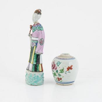 A Chinese famille rose porcelain figure and a jar, Qing dynasty (1644-1912).