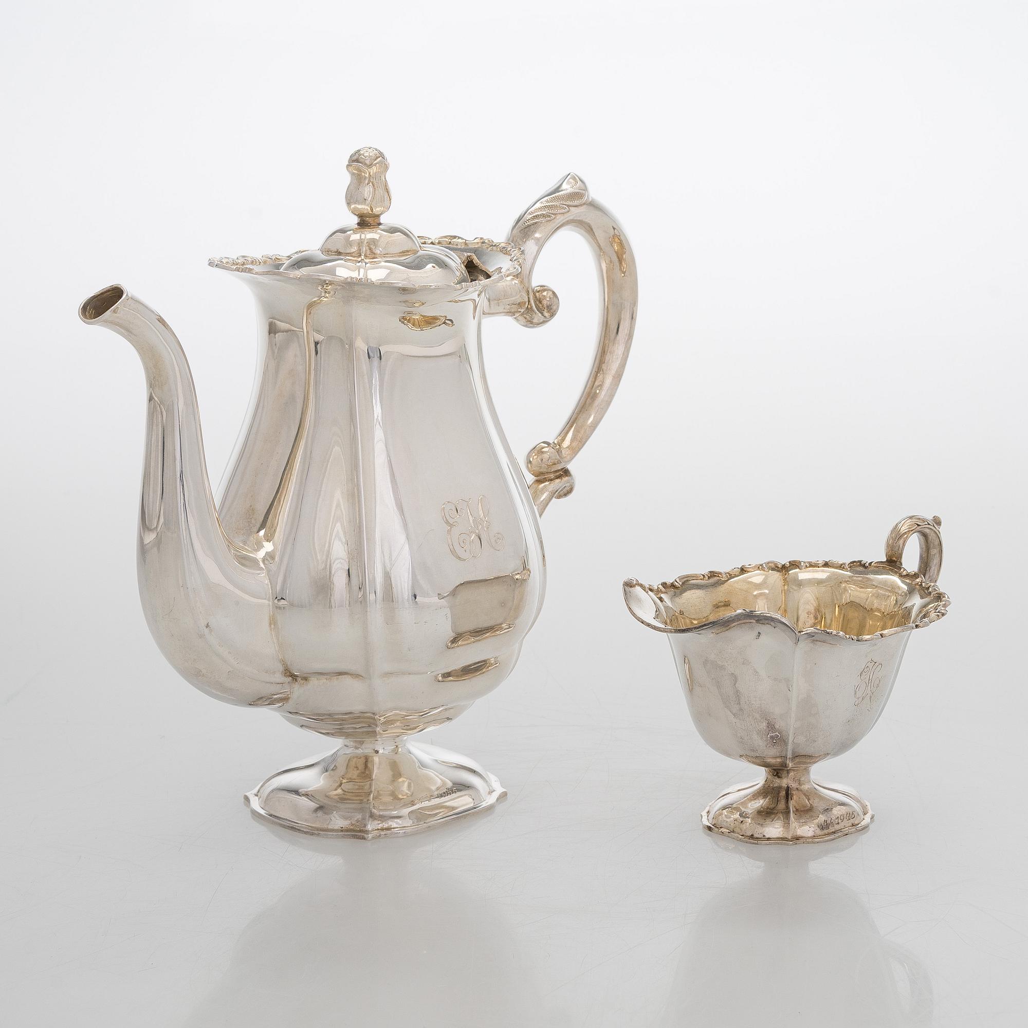 A silver coffee pot, sugar bowl, cream jug, and sugar tongs, Finland 1926-49.