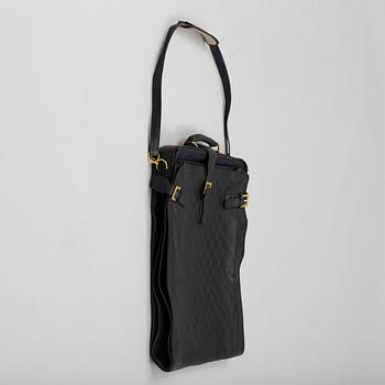 a CHANEL garment bag.