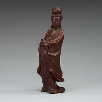 A wooden figure of Guanyin, China, early 20th Century.