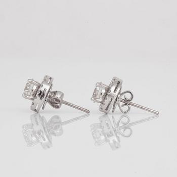 A pair of brilliant-cut diamond earrings. Center diamonds circa 0.70 cts/each.