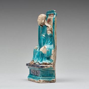 A turquoise and purple glazed figure of a dignitary, Qing dynasty, Kangxi (1662-1722).