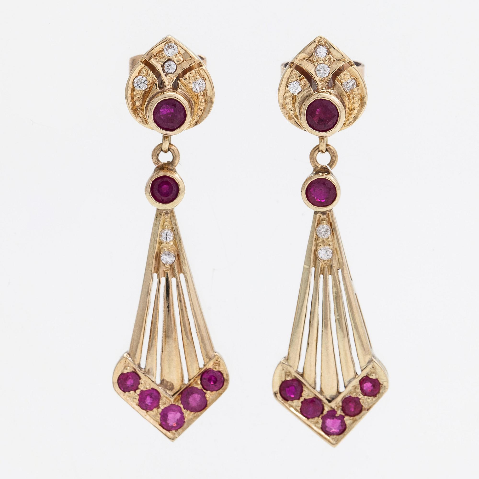 A pair of ca. 13K and 14K gold earrings with rubies and diamonds ca. 0.08 ct in total.