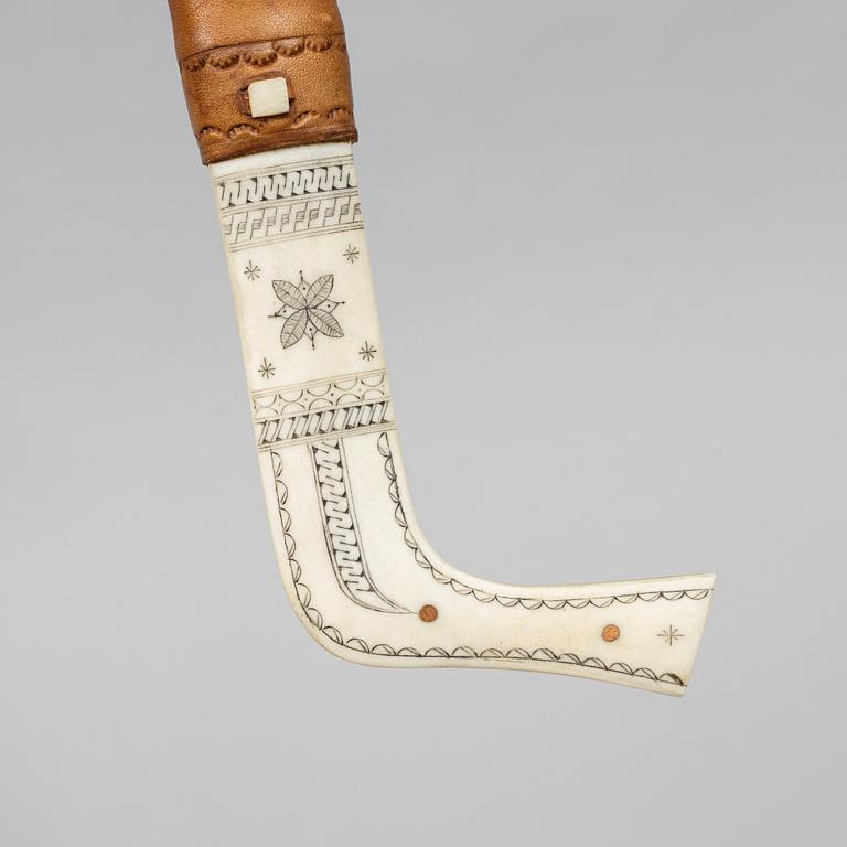 Oskar Tjäder, A reindeer horn knife, signed.