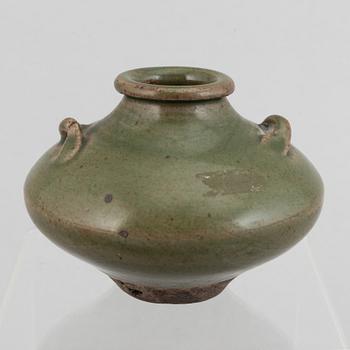 A group of four blue and white porcelain objects and a celadon green glazed jar, Qing dynasty, 18th century.