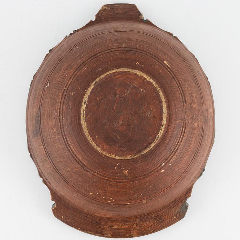 A lathed and painted bowl dated 1783.