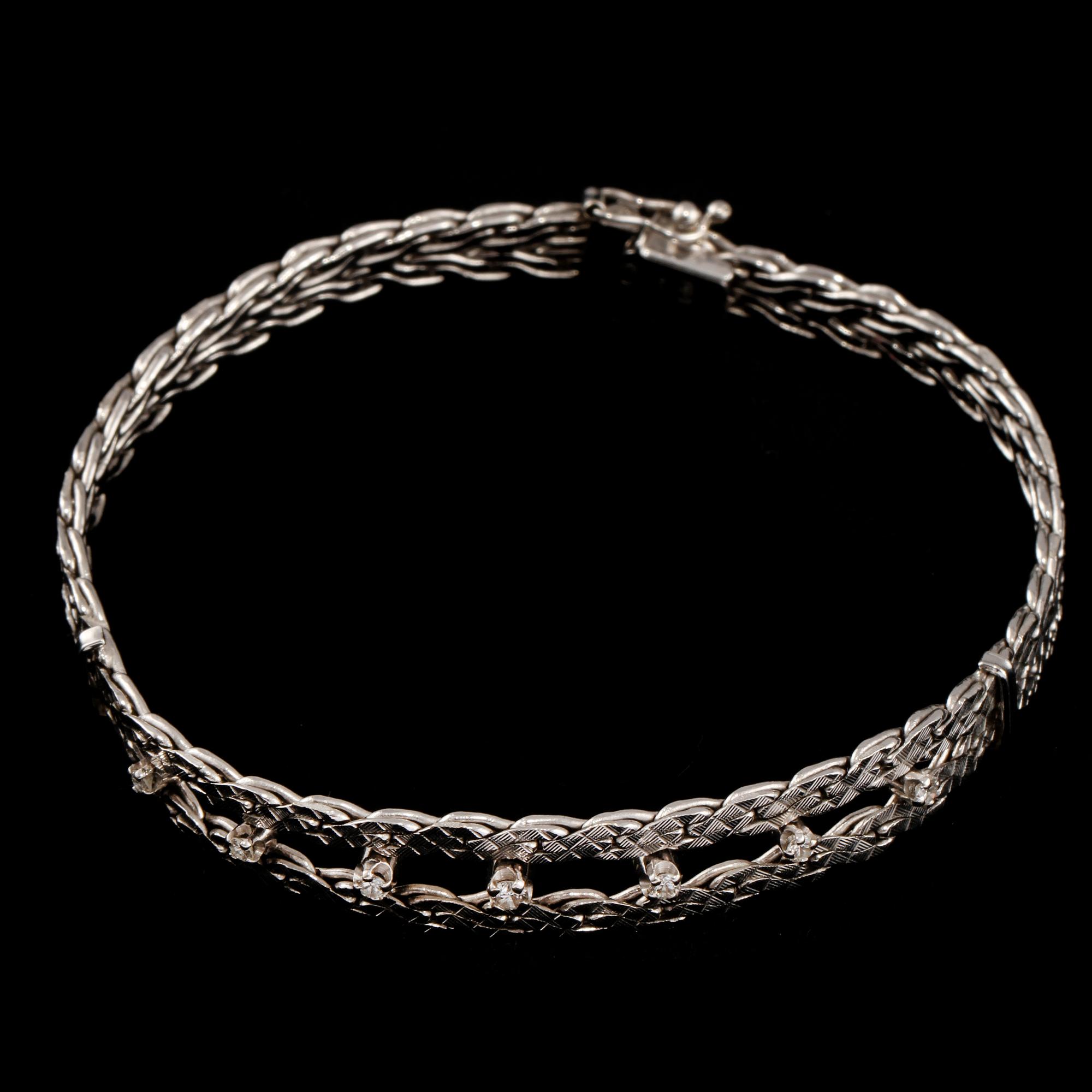 ARMBAND, 18k vitguld med 7 briljantslipade diamanter 0.27 ct, Una A Erre, Italien, importstämplad. Vikt 21 g.