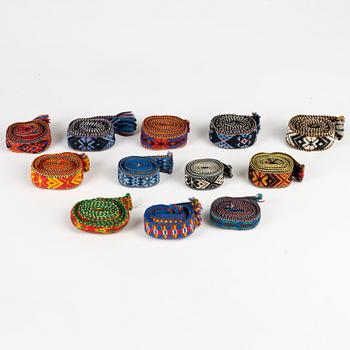 Twelve woven multicoloured bands, 20th Century.