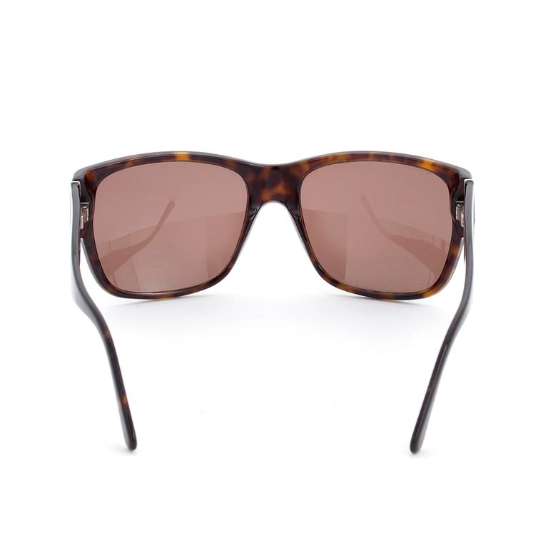 PRADA, a pair of sunglasses.