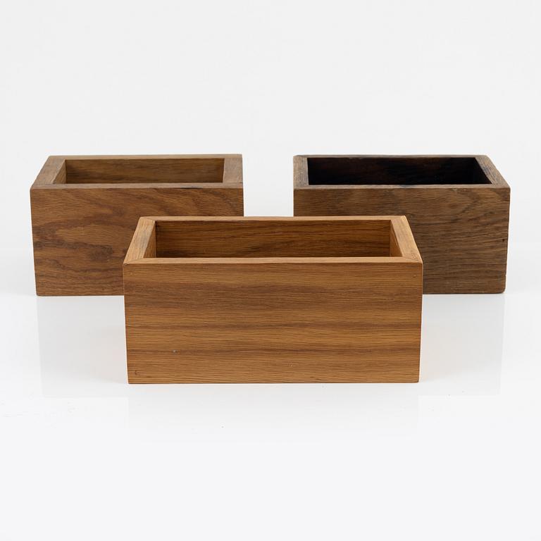 Magnus Ek, three oak wood cutlery boxes for Oaxen Krog.