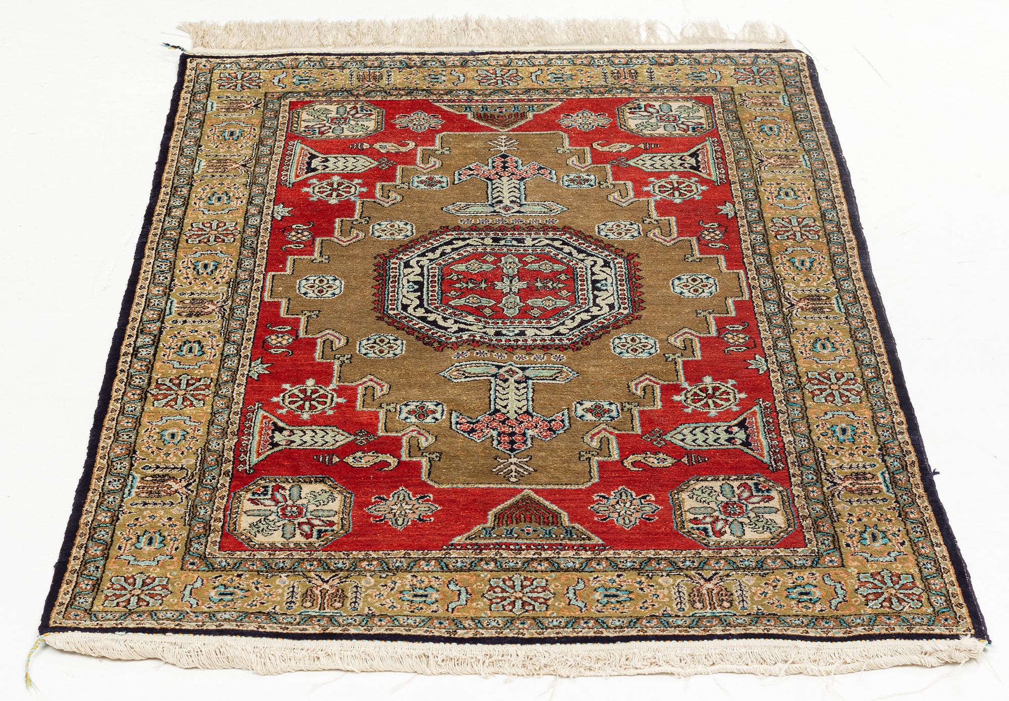 A rug, silk Quum, ca 121 x 76 cm.