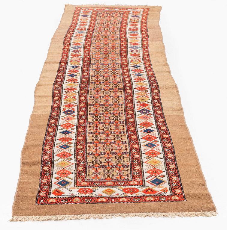 An antique Hamadan runner, northwest Persia c. 422.5 x 93.5 cm.