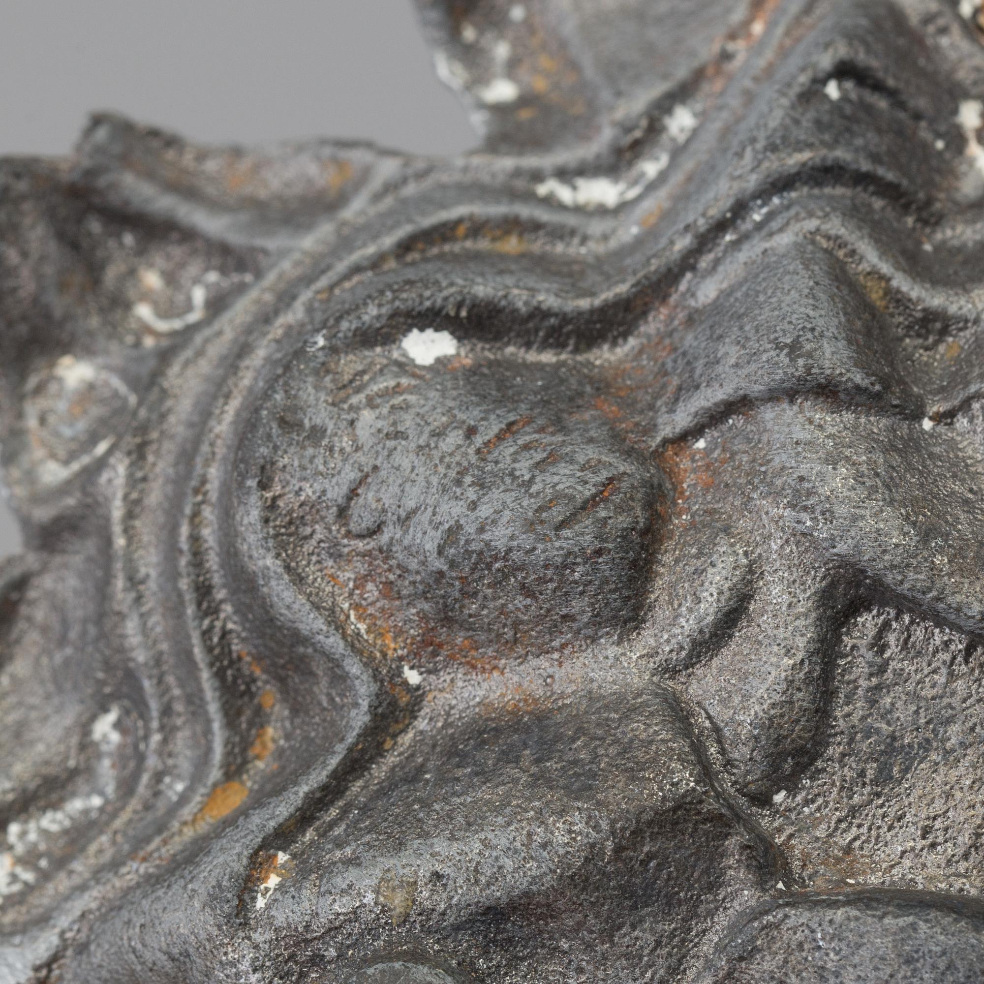 A pair of cast iron candlesticks, marked Verlag bei, A. Meves, Berlin, late 20th century.