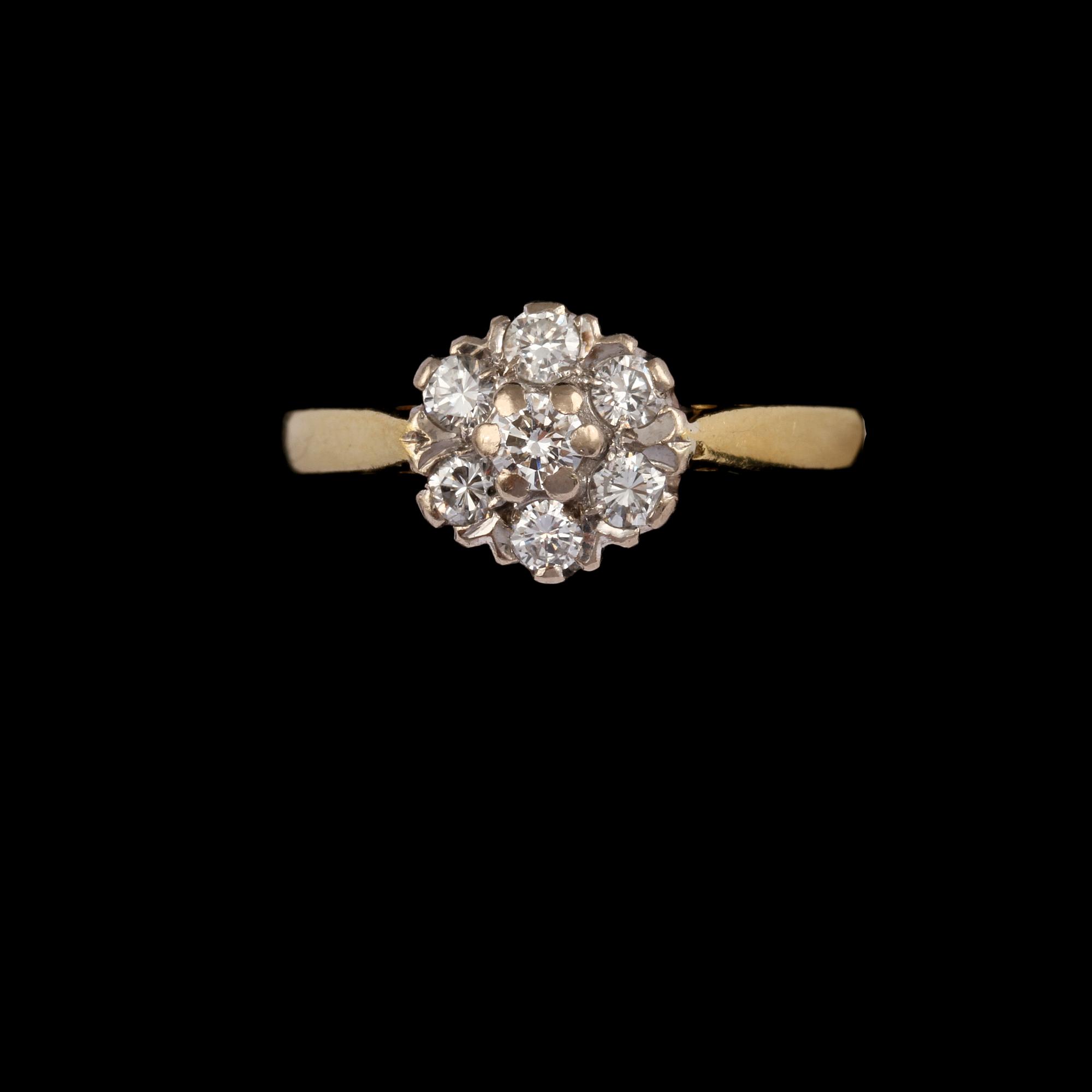 RING, 18k guld med 7 briljantslipade diamanter, totalt ca 0.35 ct, engelska stämplar. Vikt 3 g.