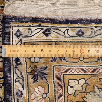 A Ghom, silk rug, c. 215 x 140 cm.