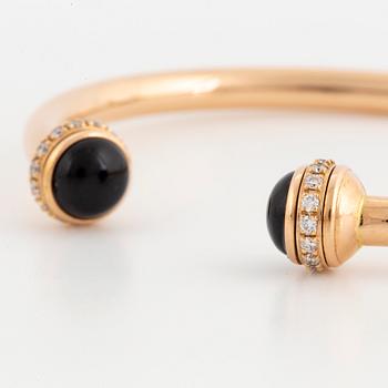 Piaget 18K rose gold, brilliant-cut diamonds and onyx cabochons.