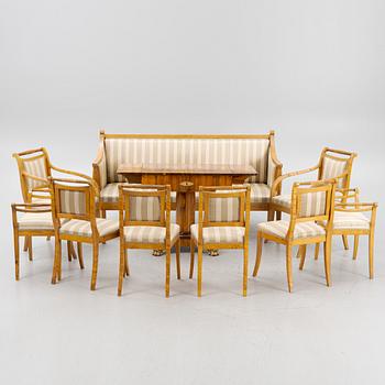 A birch sofa with two armchairs, four chairs and two stools and a mahogany center table.