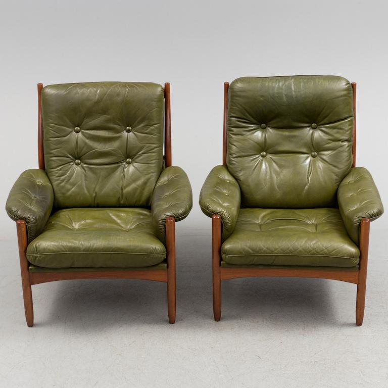 A pair of stained beech and leather easy chairs from Göte Möbler, Nässjö, second half of the 20th century.