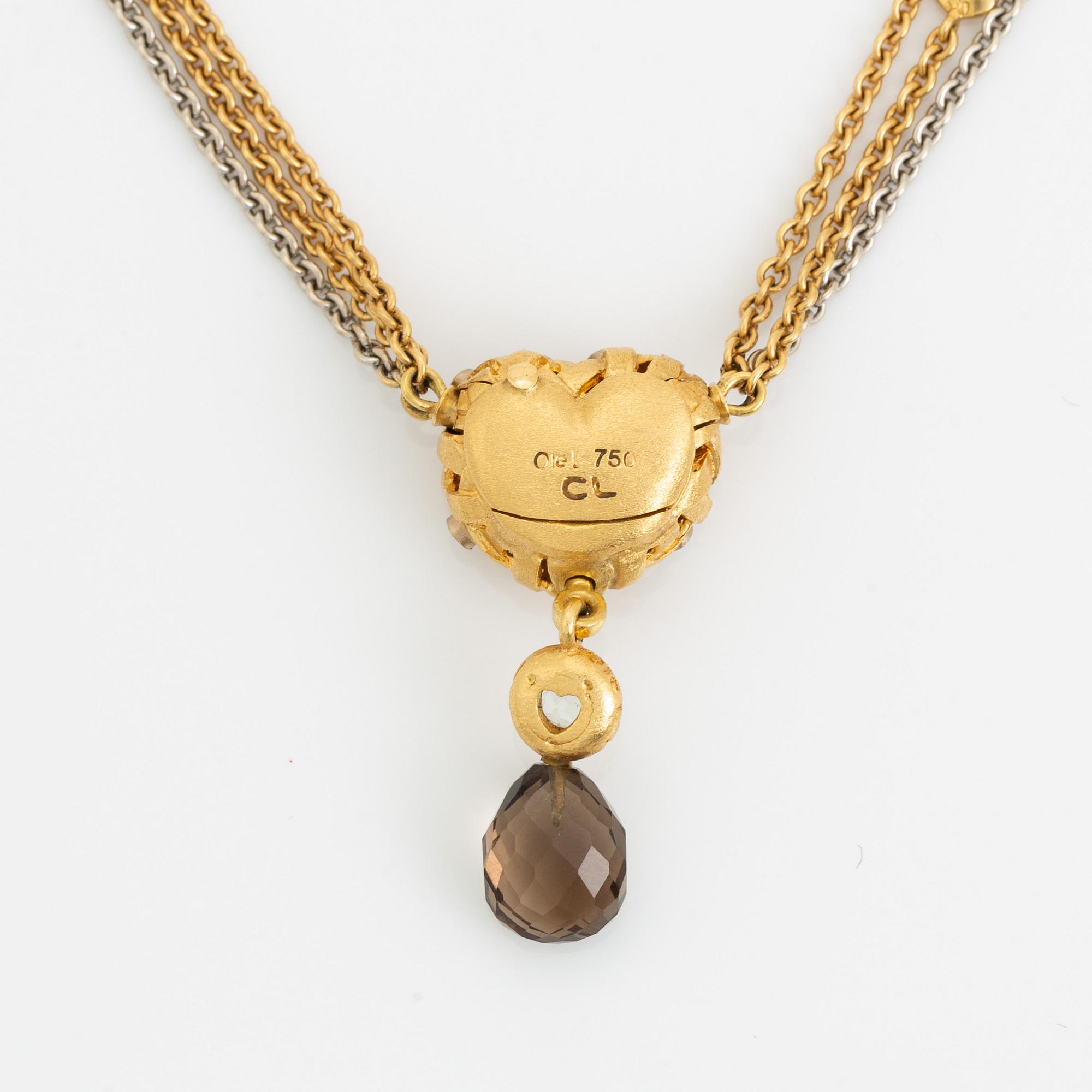 Ole Lynggaard, Charlotte Lynggaard, lås flätat hjärta med diamanter, collier, nyckelberlock med rökkvarts och akvamarin.