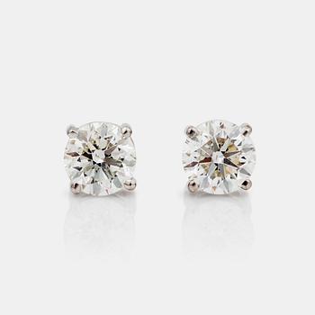 677. A pair of brilliant-cut diamond earrings, total carat weight 1.82 cts. Quality H/SI2.