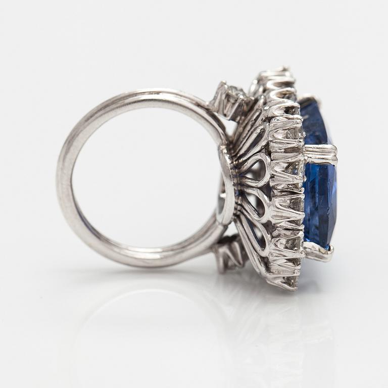 A platinum ring with a ca. 18.00 ct sapphire and ca. 3.00 cts of diamonds. With certificates.