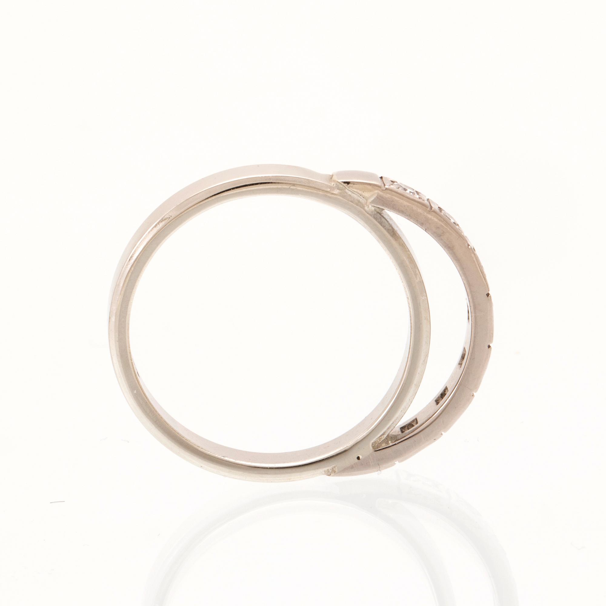 An 18K white gold ring set with round single cut dimamonds.