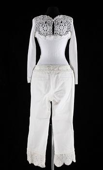 A with top and trousers with lace by Chanel, spring 2005.