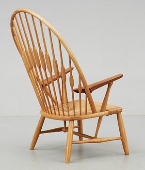 A Hans J Wegner ash and teak 'Peacock chair', Johannes Hansen, Denmark.