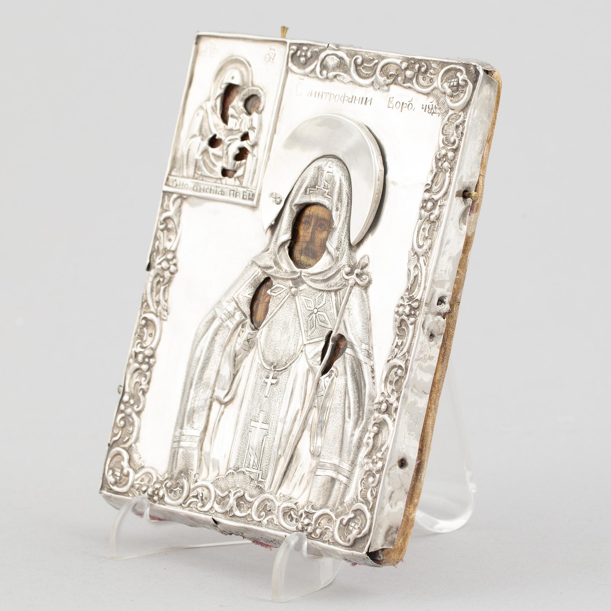 A Russian icon, with silver oklad, DN Dubinin (active 1849-54), St Petersburg.