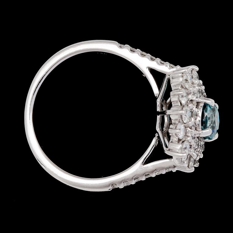 RING, brilliant cut diamonds, tot. app. 1.40 cts and natural blue zircon.
