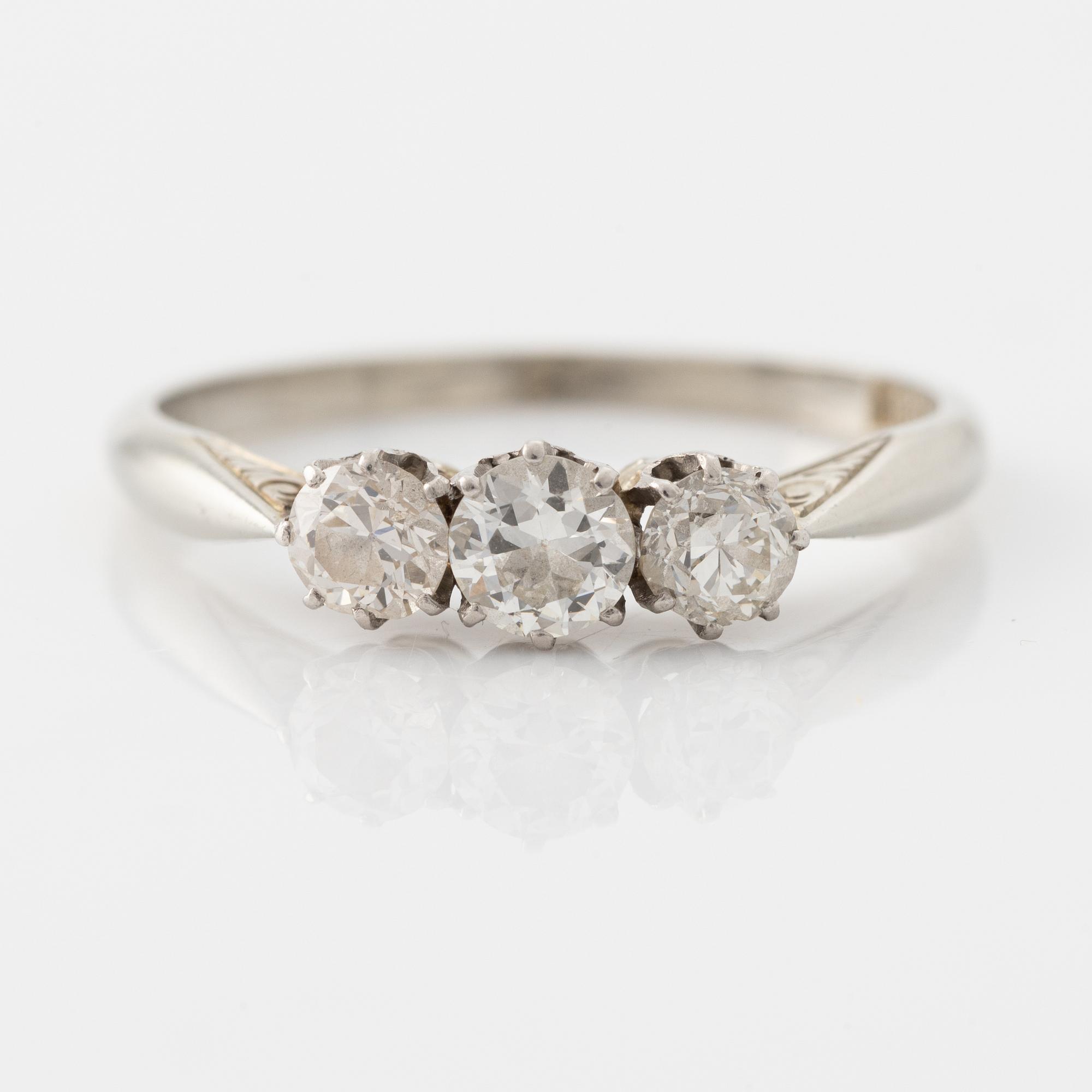 18K white gold and brilliant cut diamond three stone ring.