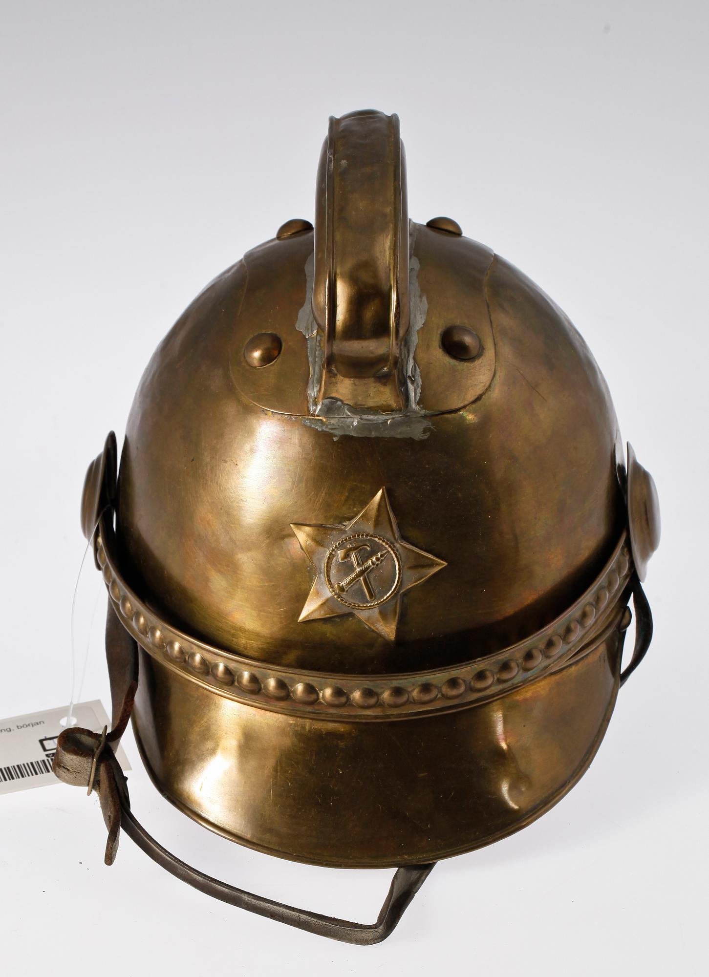 BRANDHJÄLM, mässing, 1900-talets början.