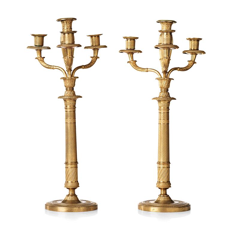 A pair of French Empire early 19th century four-light candelabra.