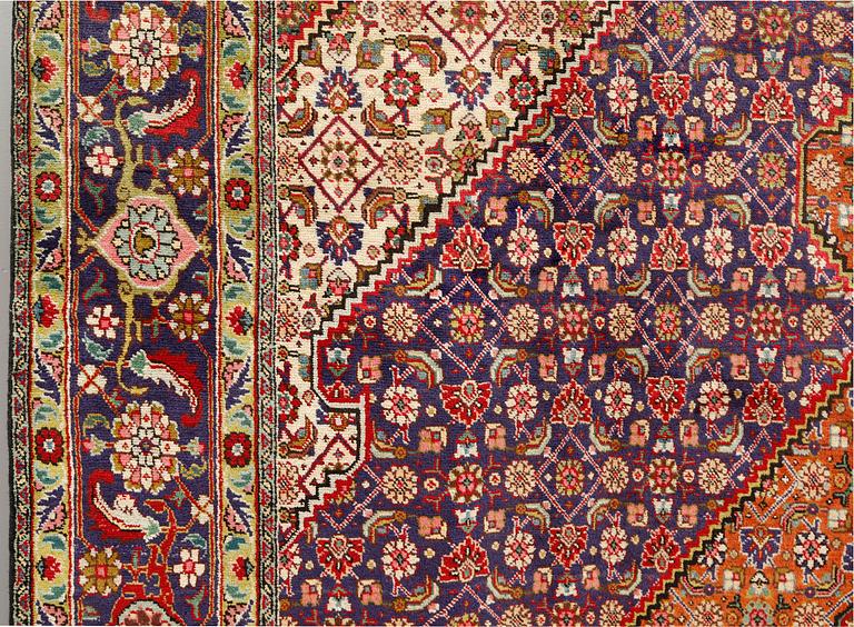 A Tabriz carpet, approximately 360 x 255 cm.