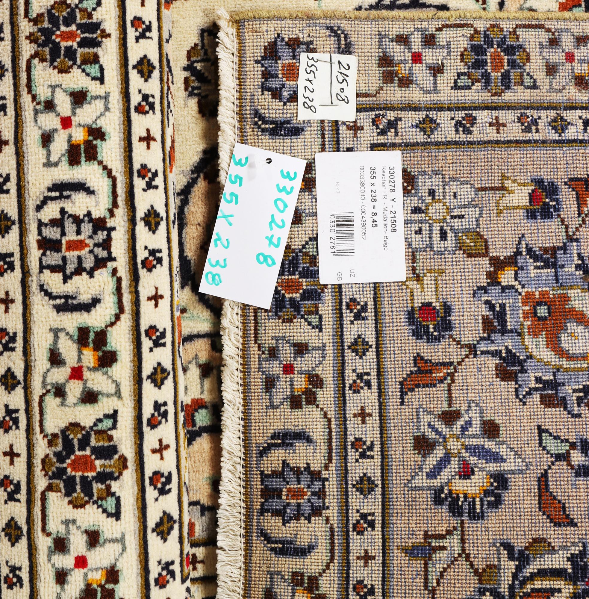 A Kashan carpet, c. 355 x 238 cm.