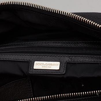 DOLCE & GABBANA, a black leather weekend bag, 2009.