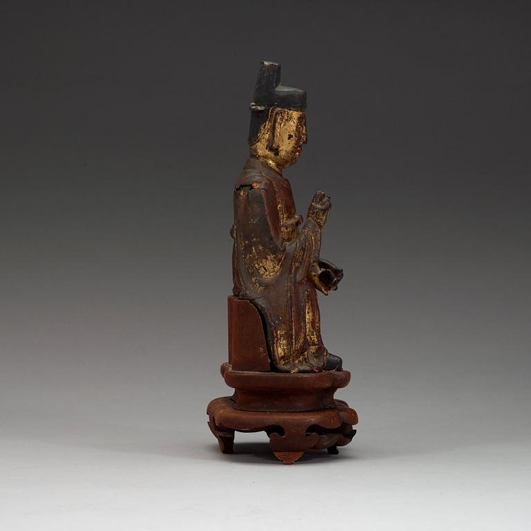 A seated figure of a daoist dignitary, Ming dynasty (1368-1644).