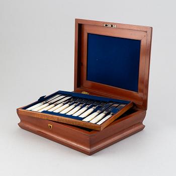 An English set of 44 silver and mother-of-pearl fruit cutlery, mark of Aaron Hadfield, Sheffield, 1846.