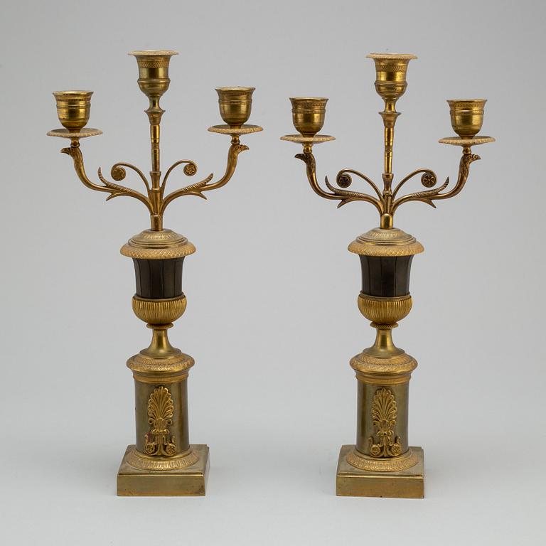 A pair of Empire bronze candelabra, first half of the 19th century.