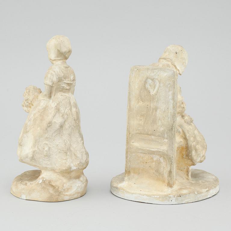 two plaster figurines, signed.