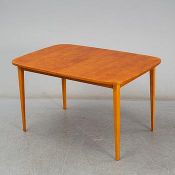 A second half of the 20th century teak veneered dining table.